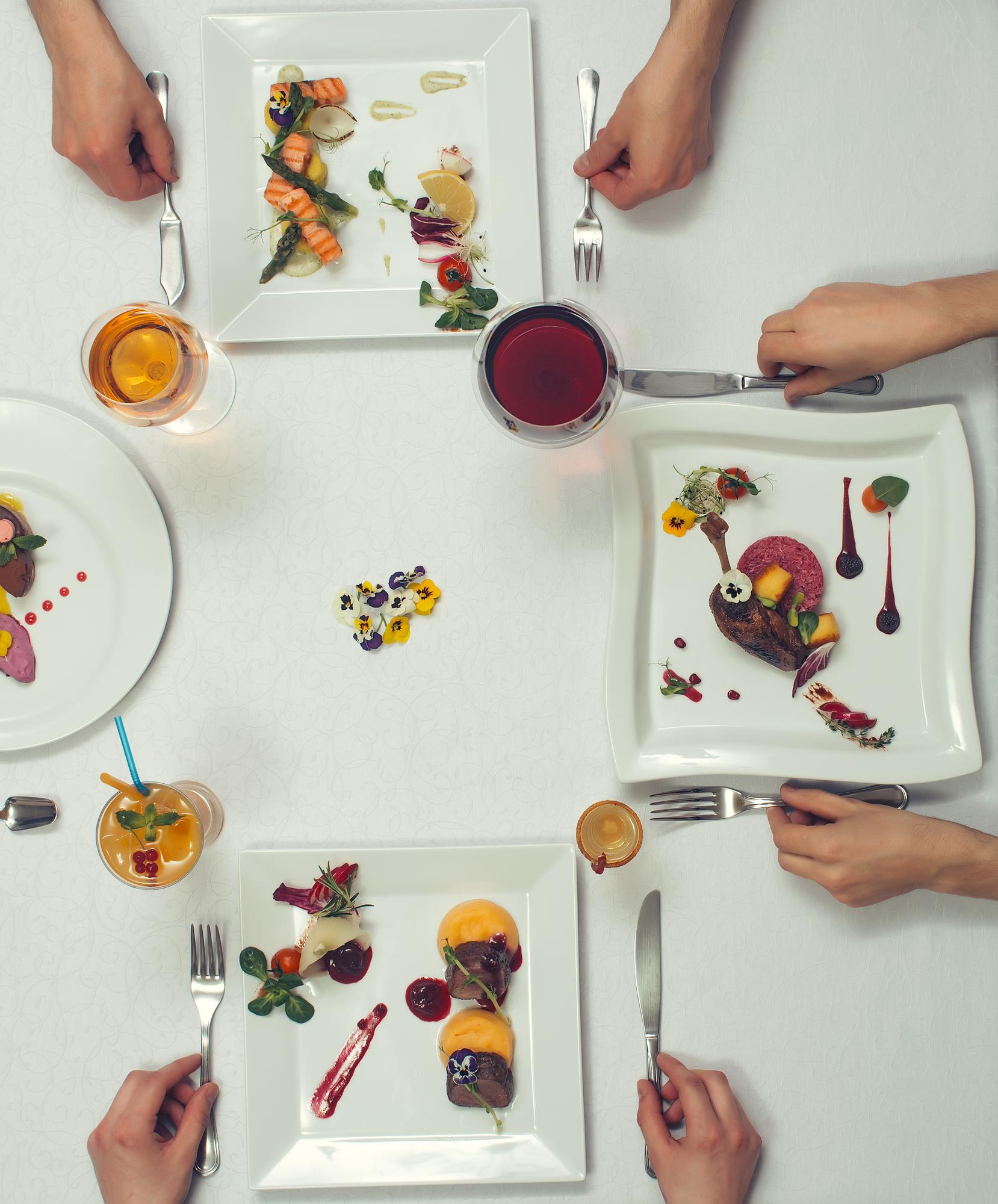 Shared table, tasting plates and cheerful faces